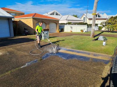 Pressure cleaning a driveway at a home in Kilaben Bay
