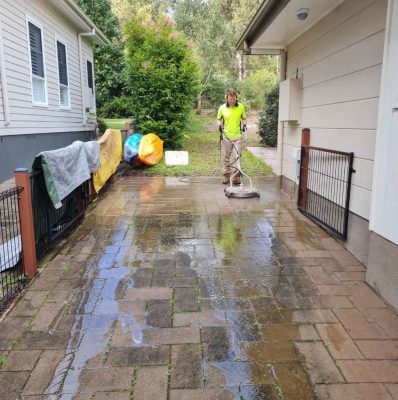 Pressure cleaning pavers on a driveway at Murrays Beach