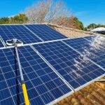 Cleaning roof mounted solar panels at Swansea