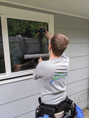 Micah is window cleaning at a house in Lisarow